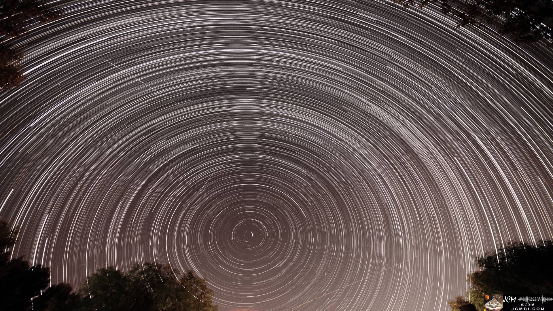 A composite image of long-exposure night sky photos taken during the Perseid Meteor Shower on 8-11-2016 JCMDI.COM
